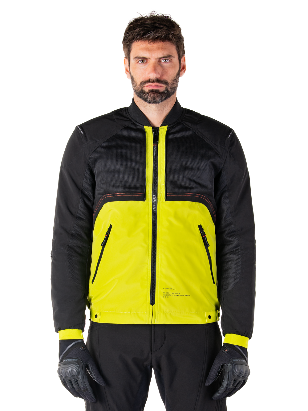 Mootant Waterproof Parka, modular motorcycle jacket, Lime Punch and Black, worn by a male model with black gloves and pants, featuring a vibrant yellow lower body and black upper torso and sleeves, utilitarian design for all-weather riding
