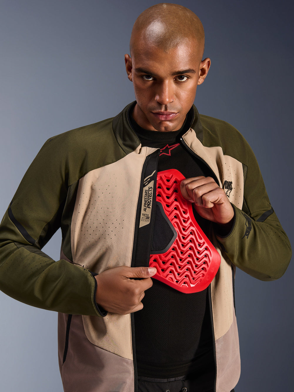 Alpinestars Aeroshell Airflow Jacket, Forest Sand motorcycle gear, featuring red chest armor and laser-perforated softshell.