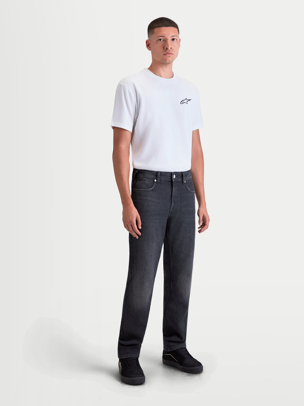 Alpinestars Flex-AST 8 Denim Pants Short, men's urban motorcycle riding jeans in used black, front full-body view on a model wearing a white t-shirt, featuring AA-rated single-layer technical denim and casual straight-leg fit.