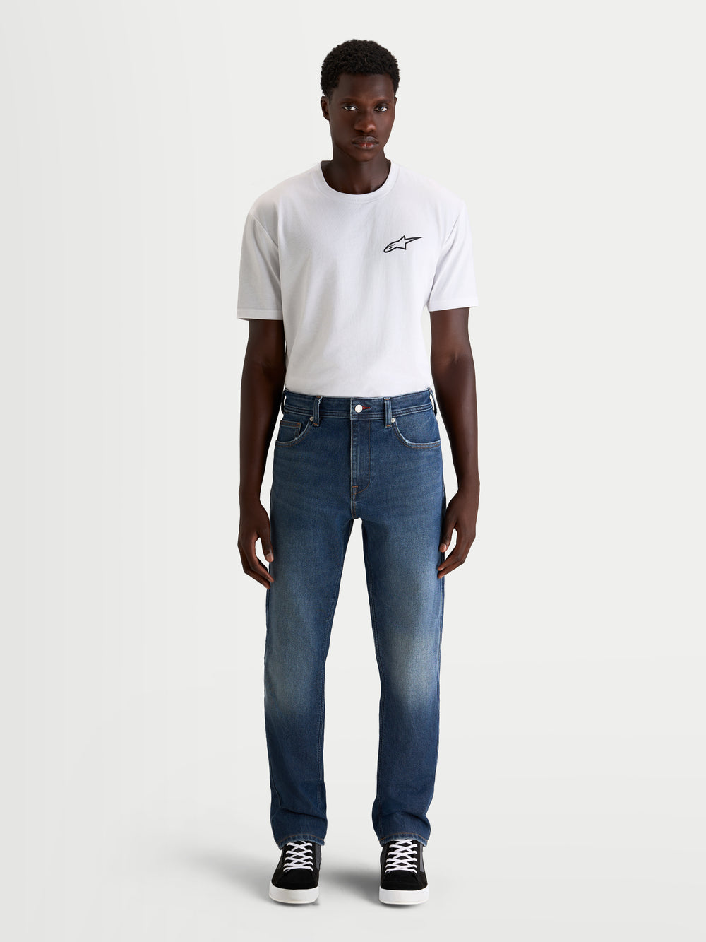 Alpinestars Flex-AST 8 Denim Pants Short, men's urban motorcycle riding jeans in medium blue, front view worn by a model wearing a white t-shirt, AA-certified protective single-layer denim with stretch comfort