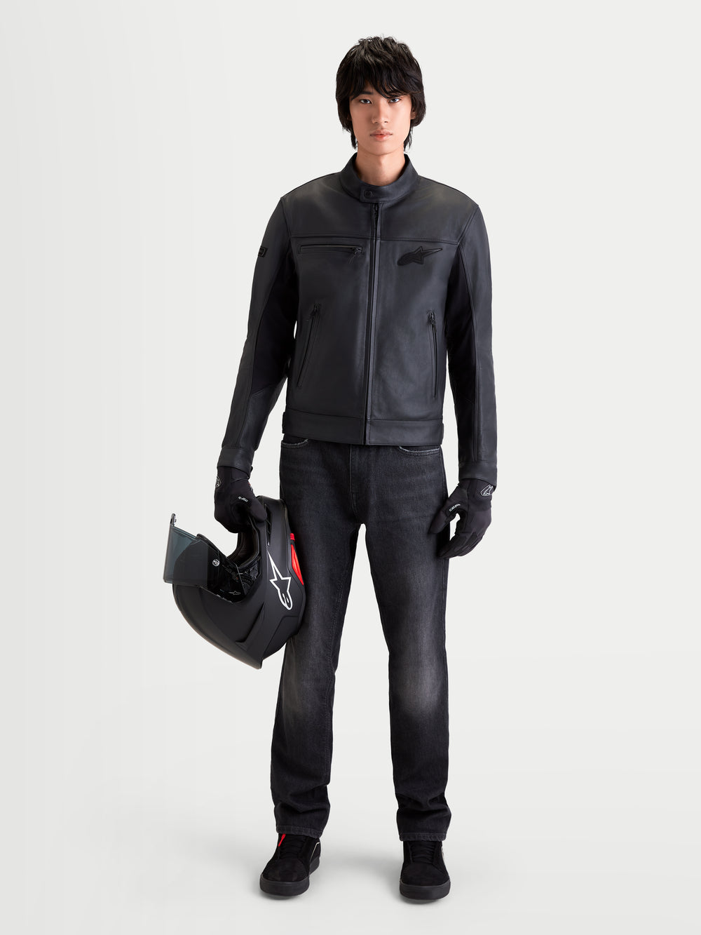 Alpinestars Flex-AST 7 Denim Pants Short, men's urban motorcycle denim pants in faded black, worn by a model holding a helmet and matching jacket, featuring AA certified protection and stretch construction