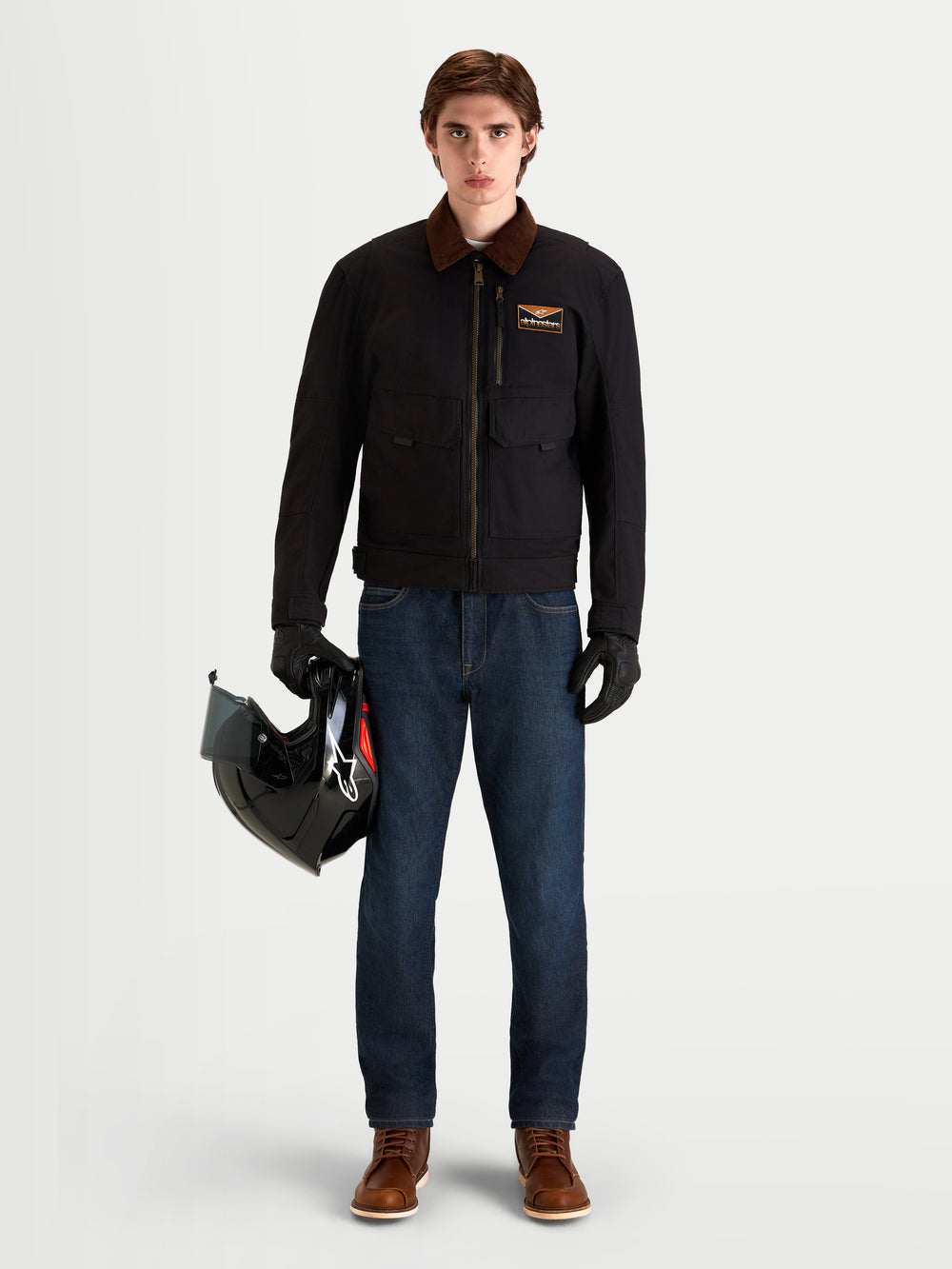 Alpinestars Flex-AST 7 Denim Pants Short, men's urban motorcycle riding jeans in dark blue, front full-length view on a model wearing matching black jacket, gloves, and helmet.
