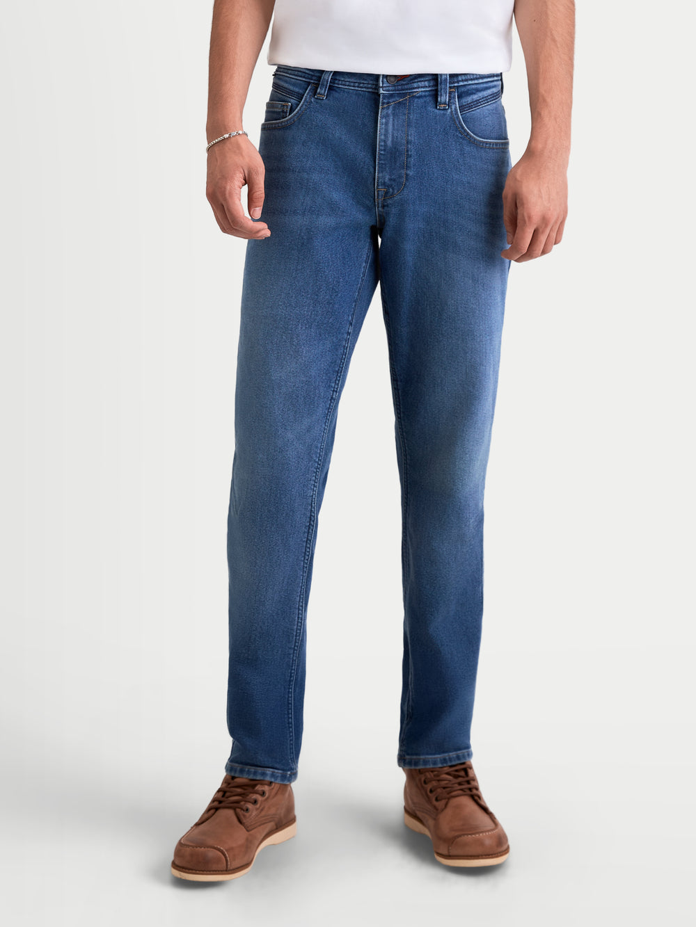 Alpinestars Flex-AST 7 Denim Pants Short, men's urban motorcycle riding jeans in light blue, front view on a model wearing casual apparel and brown boots, AA certified technical denim with single-layer construction