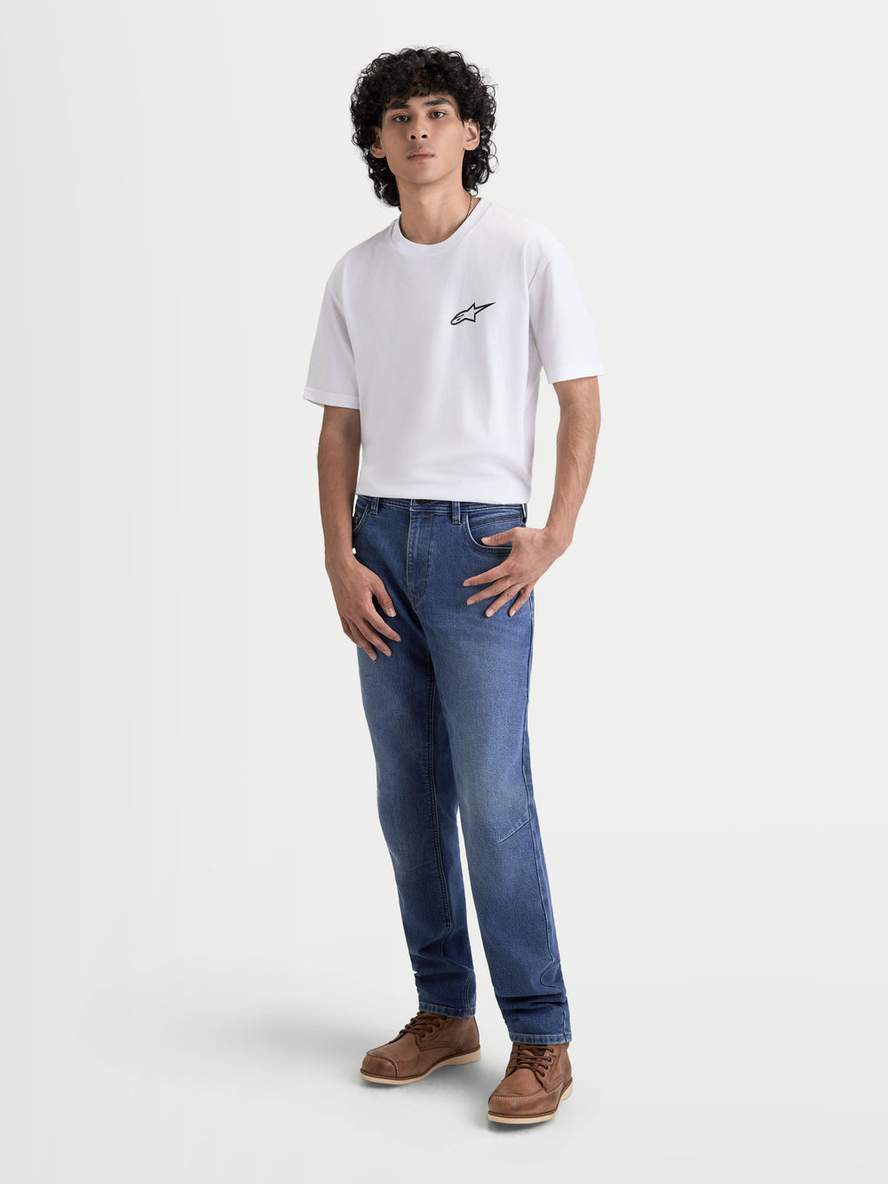 Alpinestars Flex-AST 7 Denim Pants Short, men's urban motorcycle riding jeans in light blue, worn by a model standing against a light background, AA certified technical riding denim