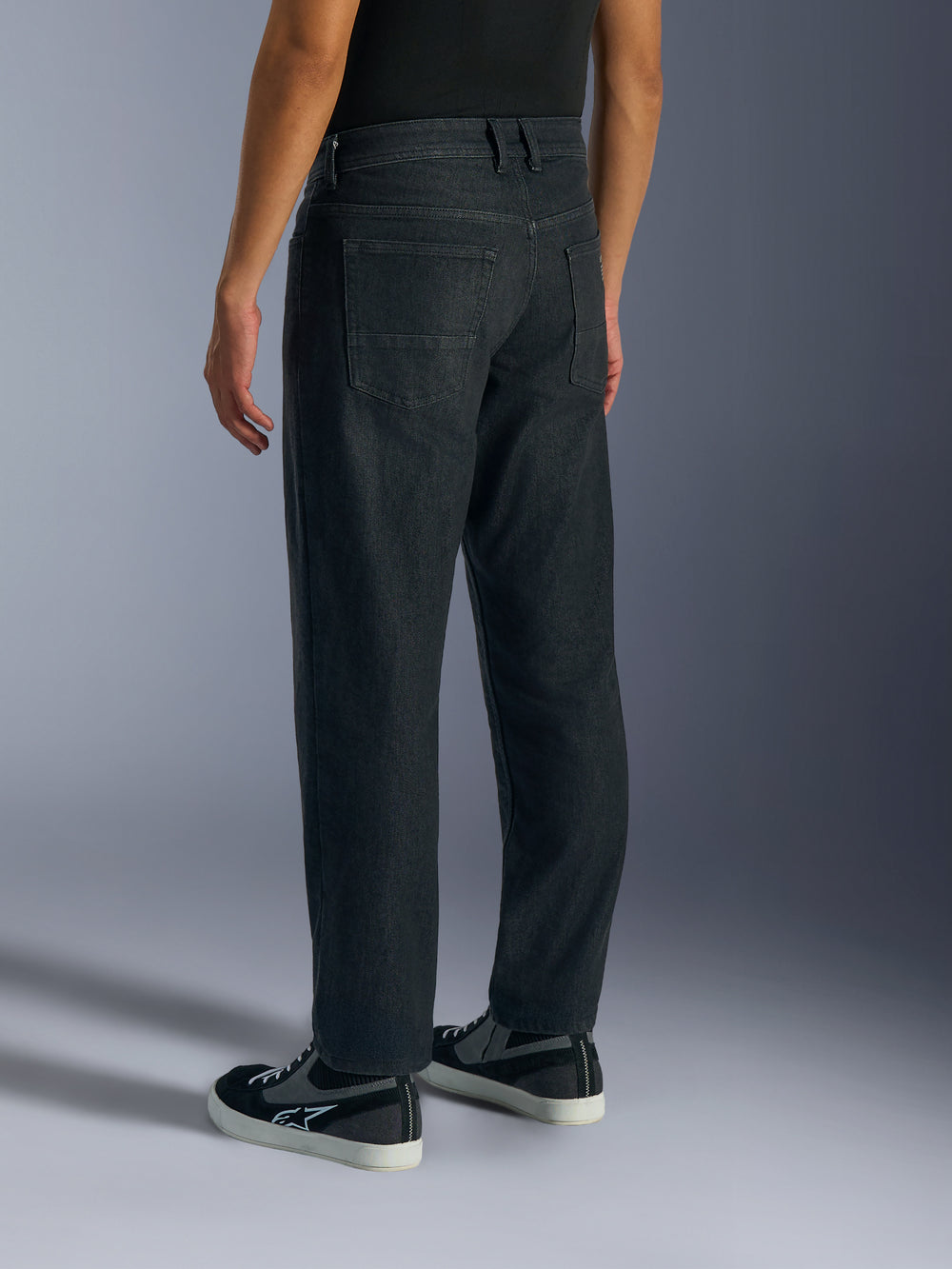 Alpinestars Flex-AST 5 Denim Pants, Men's Motorcycle Riding Jeans in Black Washed, back side view on model showing regular tapered cut, rear pockets, and monolayer stretch denim construction.