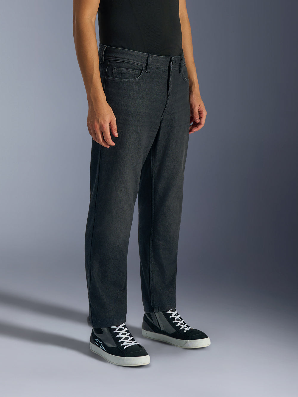 Alpinestars Flex-AST 5 Denim Pants in Black Washed, front three-quarter view on model highlighting the regular tapered fit and durable stretch denim construction of these CE-certified urban motorcycle riding pants.