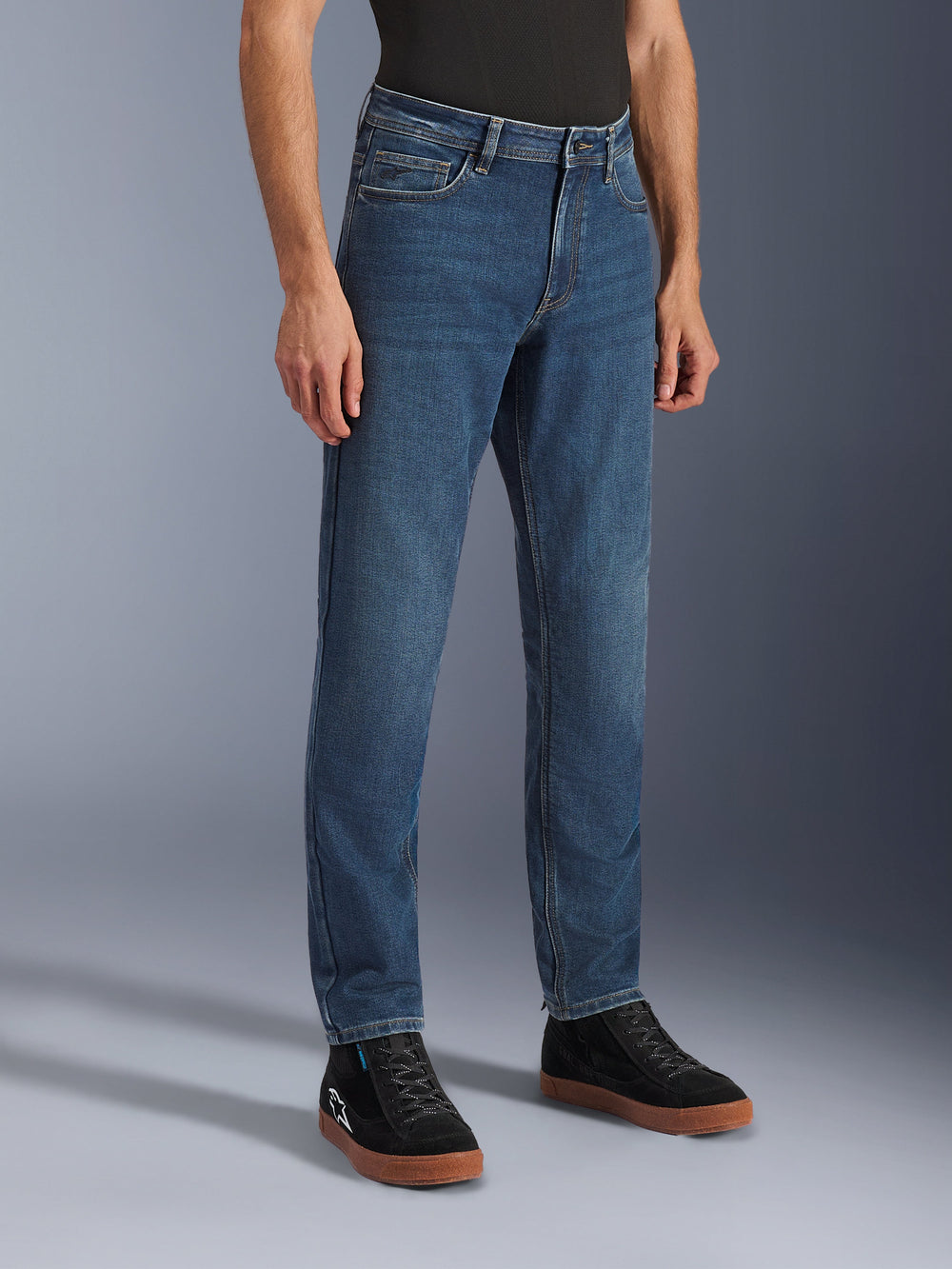 Alpinestars Flex-AST 5 Denim Pants in Indigo Washed Blue, Men's Urban Motorcycle Jeans, front three-quarter view on model featuring tapered fit monolayer stretch denim and CE Class A protection.