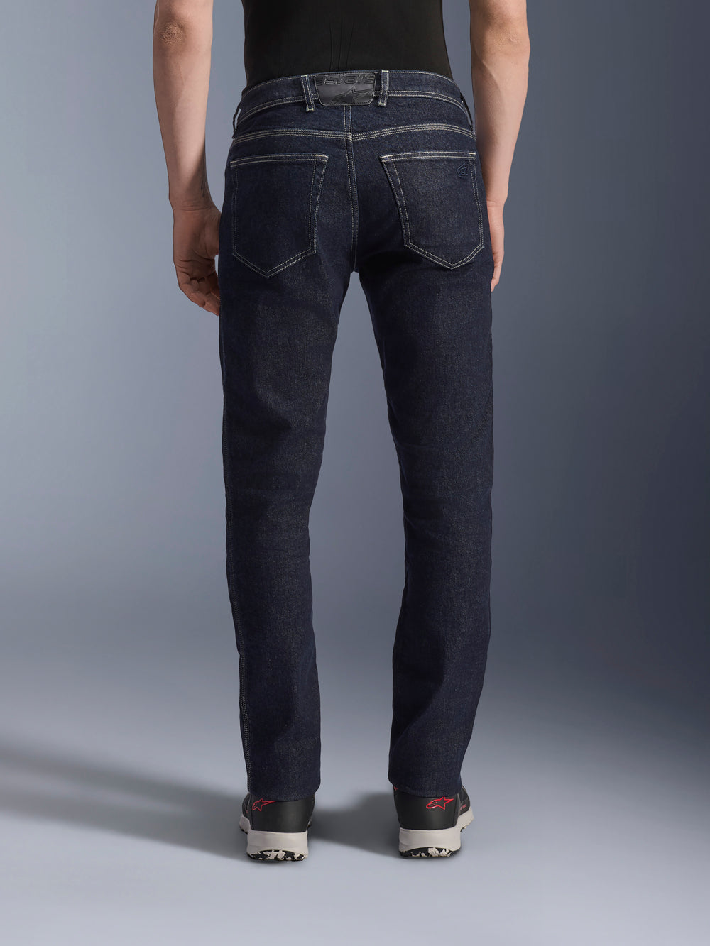 Alpinestars Copper V3 Denim Pants, Men's Urban Motorcycle Riding Jeans in Rinse Blue, back view on model showing regular straight-leg fit, rear pockets, and contrast stitching.