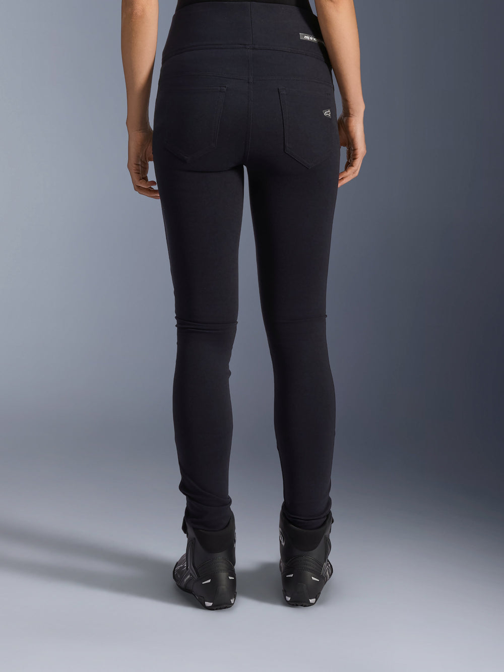 Alpinestars Stella Flex-Ast Leggings, Women's Motorcycle Leggings, Black, rear view showing back pockets and slim fit, worn with black motorcycle boots, urban riding style