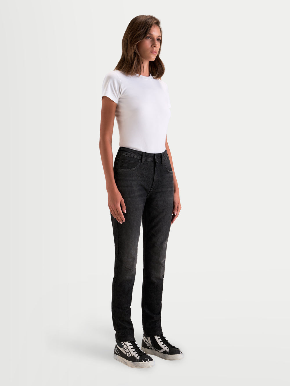 Alpinestars Stella Flex-AST 5 Denim Pants, women's urban contemporary motorcycle denim pants in black washed, side profile view on a model wearing single-layer stretch riding jeans with CE protection.