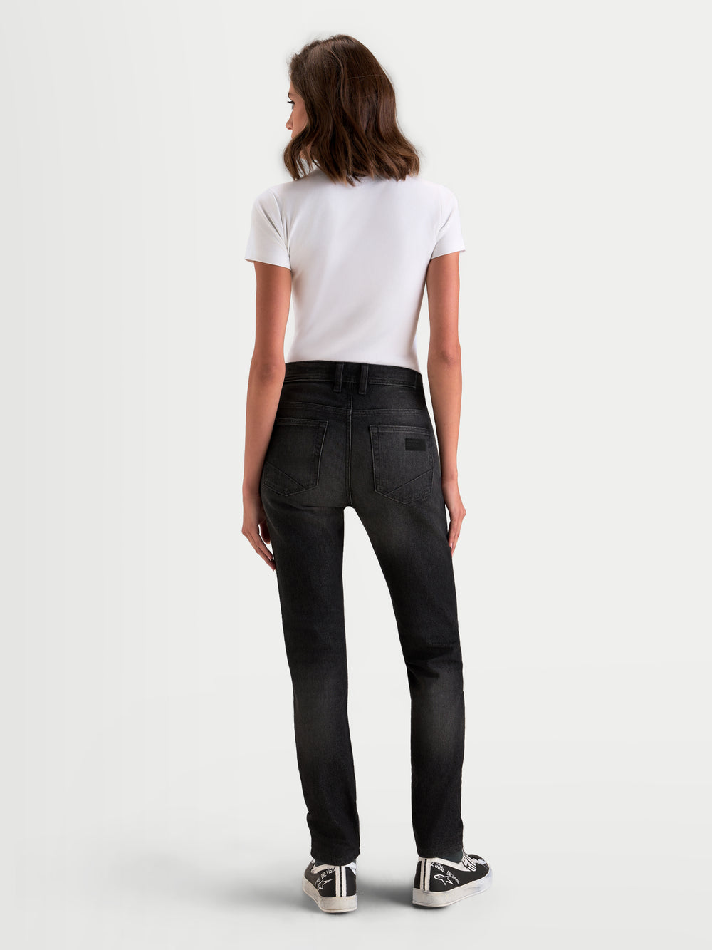 Alpinestars Stella Flex-AST 5 Denim Pants, women's urban contemporary motorcycle denim pants in black washed, rear view showing single-layer technical denim construction and raised back waistband worn by a model.