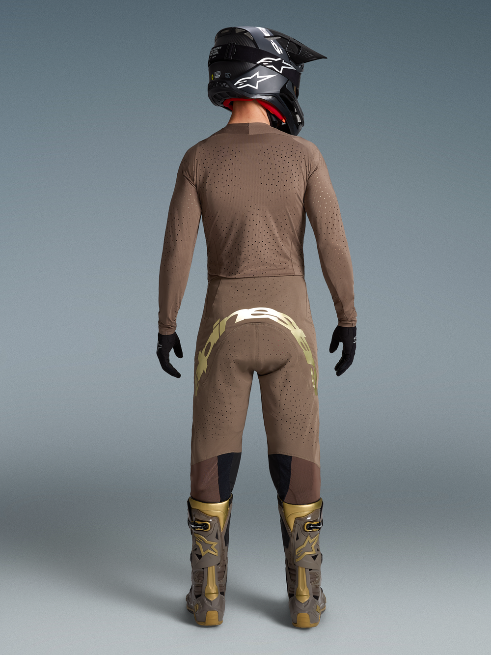 Alpinestars Limited Edition Supertech Air Gold motocross gear, men's ventilated brown and gold jersey, pants, and boots.