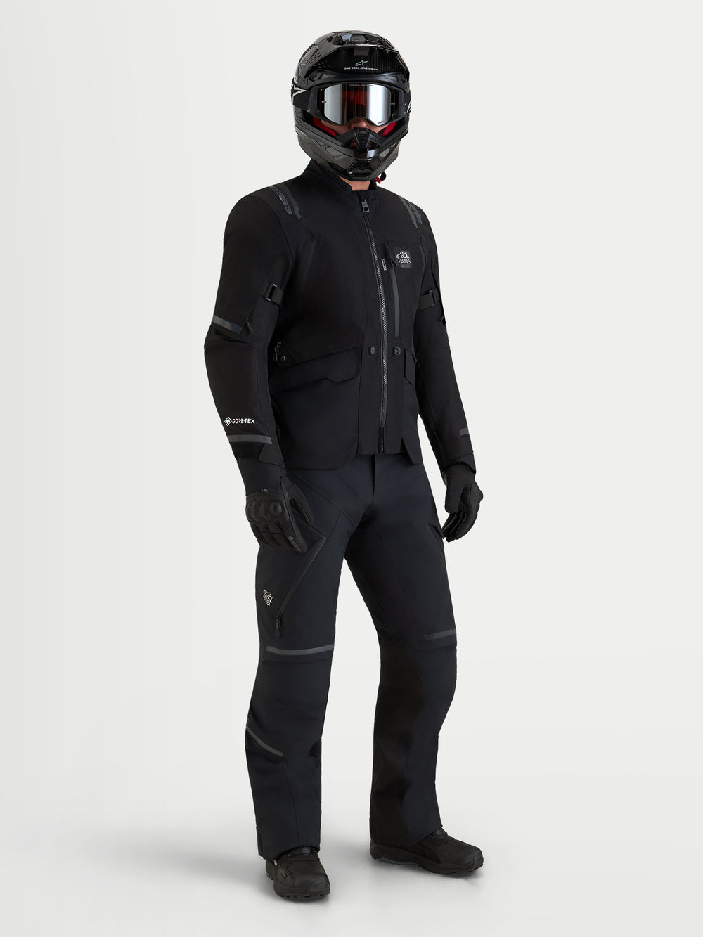 Alpinestars St-7 V2 2L Gore-Tex Jacket, Men's Black adventure motorcycle touring jacket with GORE-TEX waterproof construction worn with matching black riding gear and helmet