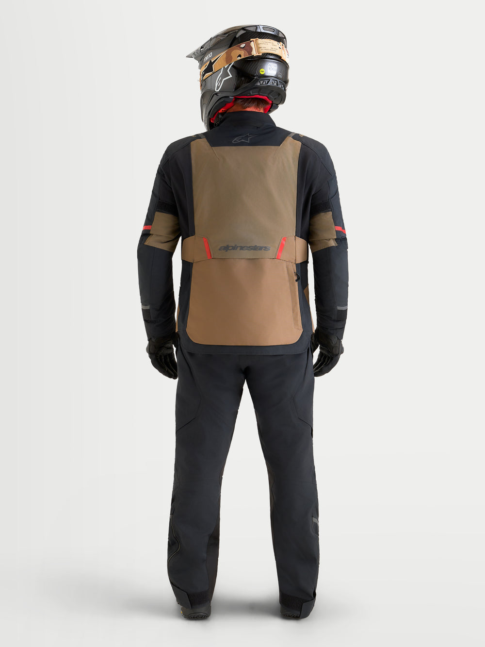 Alpinestars St-7 V2 2L Gore-Tex Jacket, Men's Adventure Touring Motorcycle Jacket, Walnut and Black, rear view showing a rider wearing the jacket with a matching helmet and pants
