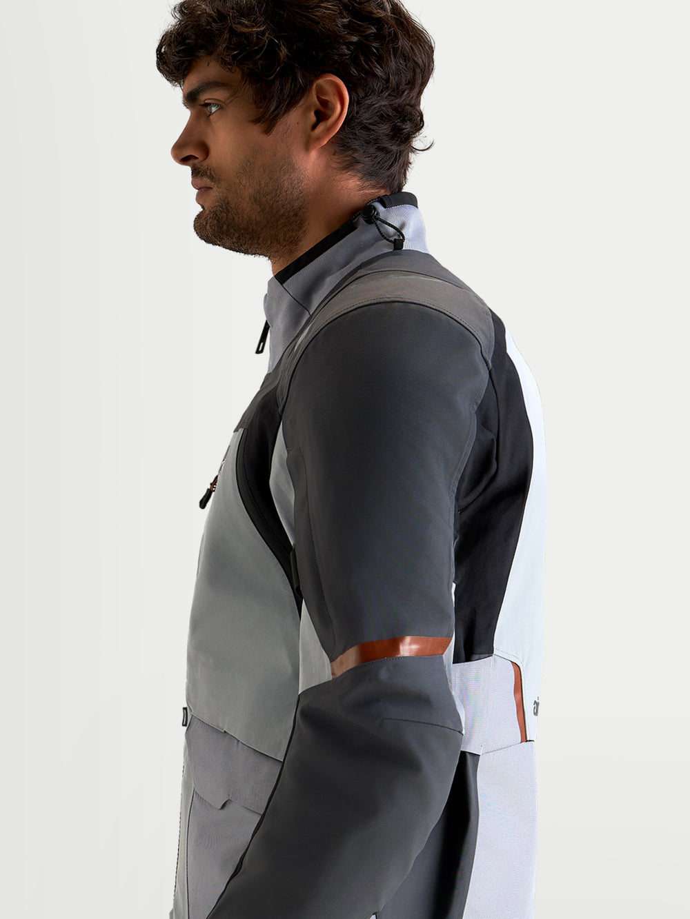 Alpinestars St-7 V2 2L Gore-Tex® Jacket, men's adventure touring motorcycle jacket in mid gray, deep gray, and black, side profile view showing waterproof textile construction and ergonomic collar.