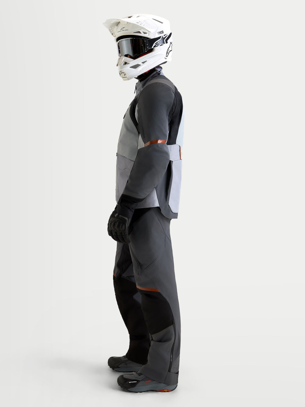 Alpinestars St-7 V2 2L Gore-Tex Jacket, Men's Adventure Touring Motorcycle Jacket in Mid Gray, Deep Gray, and Black, featuring a waterproof GORE-TEX shell, on-model side view with matching riding gear