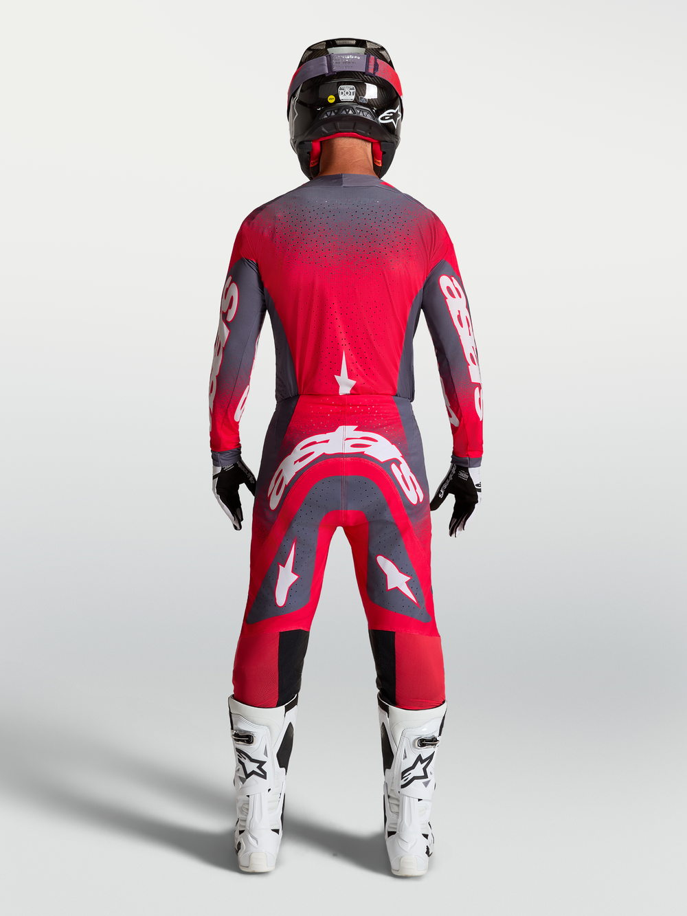 Alpinestars Supertech Hiten AFD Gear Set AND Pants, Motocross Racing Gear, Red Fluo and Graystone, rear view on model.