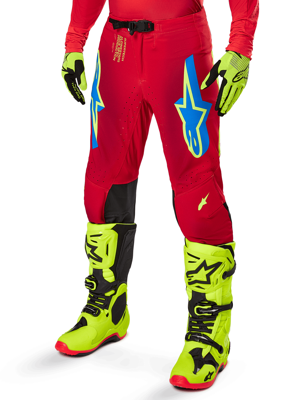 Alpinestars 2025 Supertech Maker Pants, Motocross Racing Pants, Bright Red with blue and yellow star logos, black knee panels, perforated ventilation, coordinated with neon yellow boots and gloves