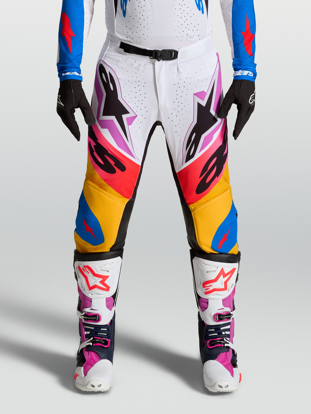 Alpinestars Supertech Dyna Pants, Motocross Racing Gear for Men, Multicolored Blue, Purple and White, stretch rip-stop construction with leather inner knee panels.