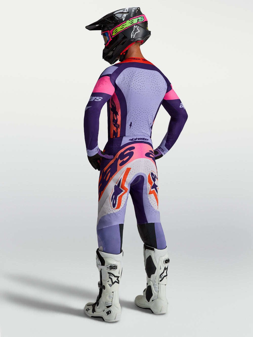 Alpinestars Supertech Dyna Pants AND Gear Set in purple and pink fluo, high-performance men's motocross gear, rear view.