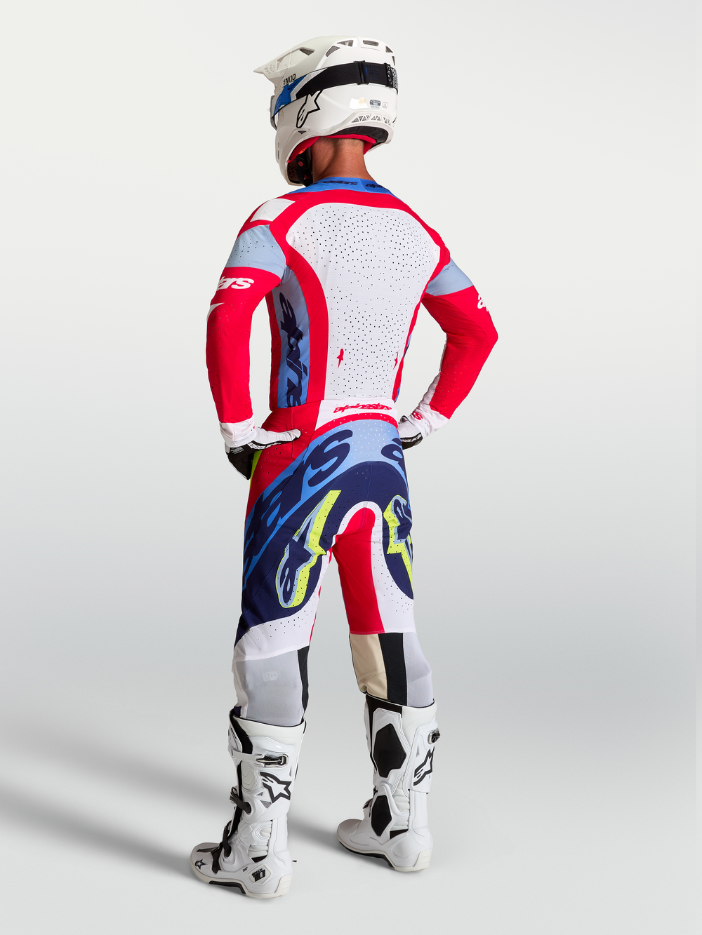 Alpinestars Supertech Dyna Pants, Men's Motocross Gear in Fire Red and Navy Blue, lightweight athletic fit on model.