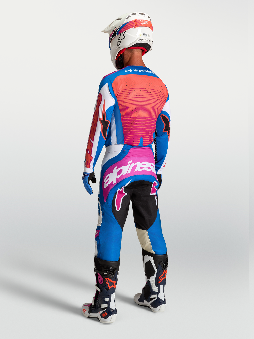 Alpinestars Techstar Maven Pants in Blithe Blue and Hot Coral, high-performance motocross gear with a race-fit design.