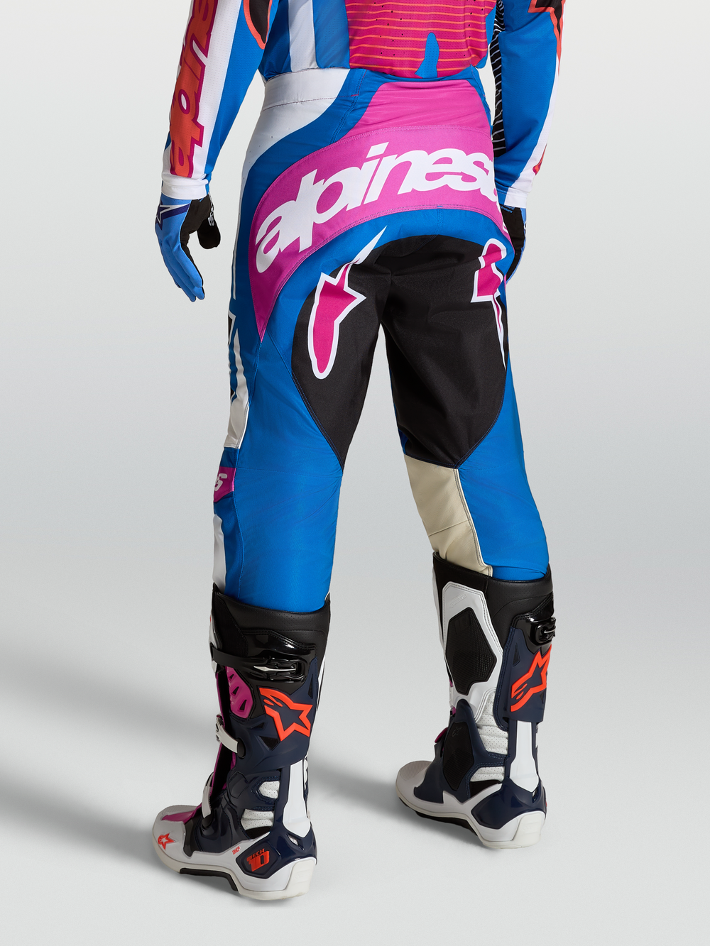 Alpinestars Techstar Maven Pants, Blue and Red motocross gear for men, featuring durable polyfabric, 4-way stretch panels, and a Babel knee gusset for racing performance.