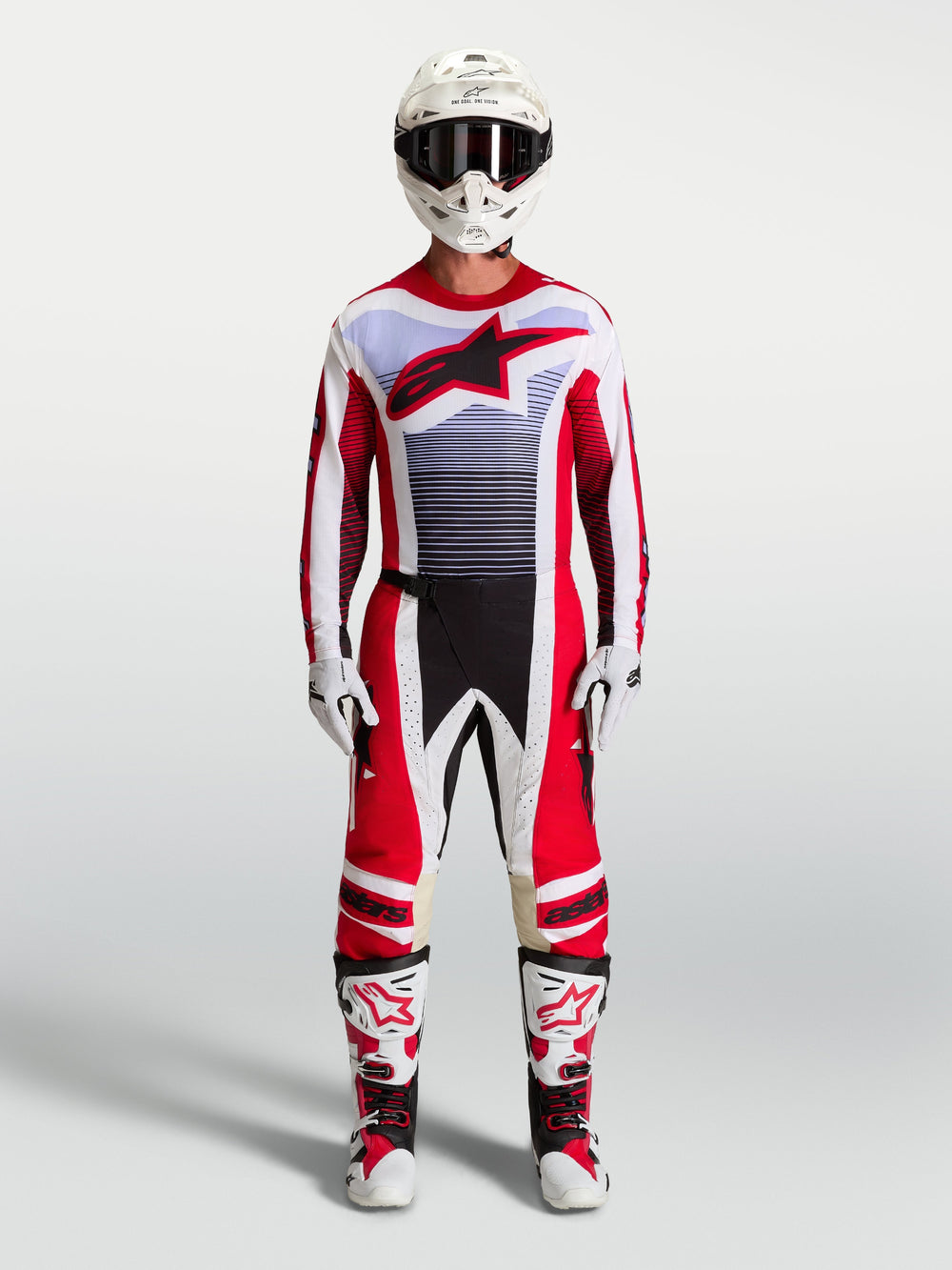 Alpinestars Techstar Maven Pants and motocross gear set in fire red and white with lavender accents and matching boots.