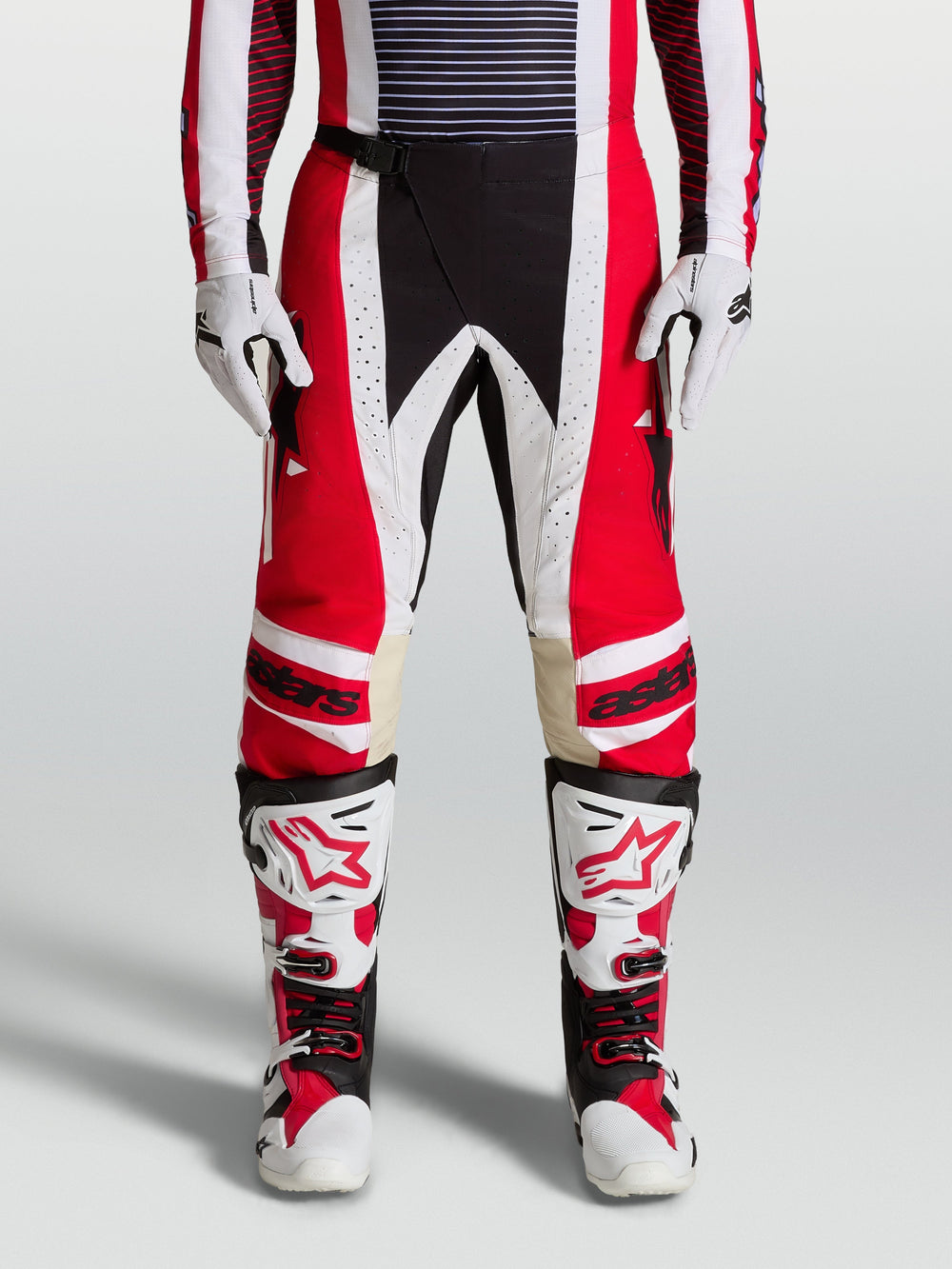 Alpinestars 2027 Techstar Maven Pants, fire red and white motocross racing pants with black accents and leather knee panels.