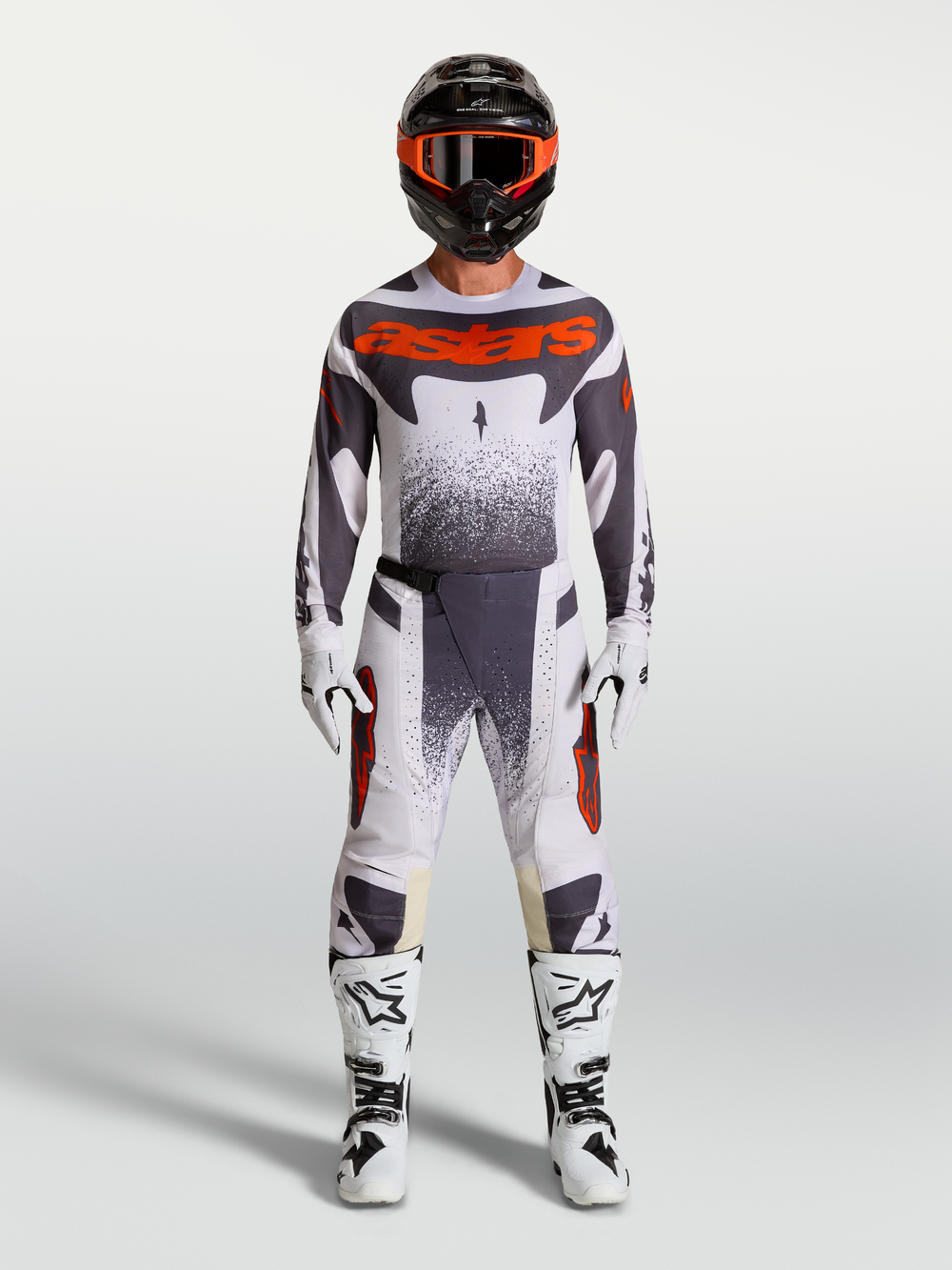Alpinestars Techstar Swan Pants, men's motocross gear set in light lilac, dark gray, and red fluo with white boots.