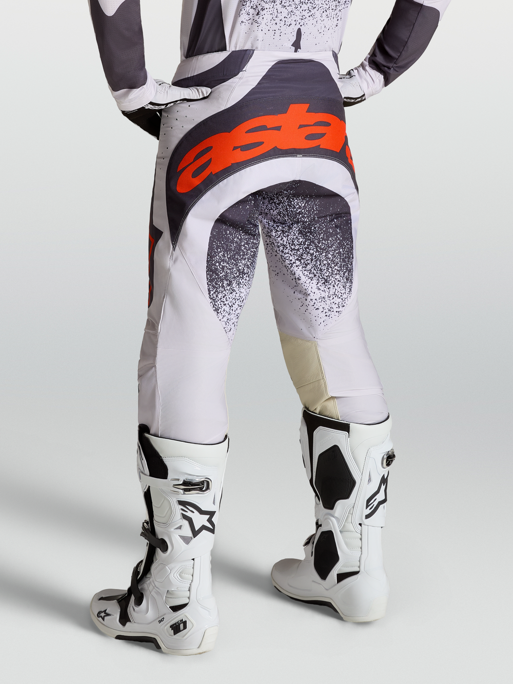 Alpinestars Techstar Swan Pants, Motocross Racing Pants for Men, Light Lilac and Dark Gray, Red Fluo accents, with Tech 10 boots.