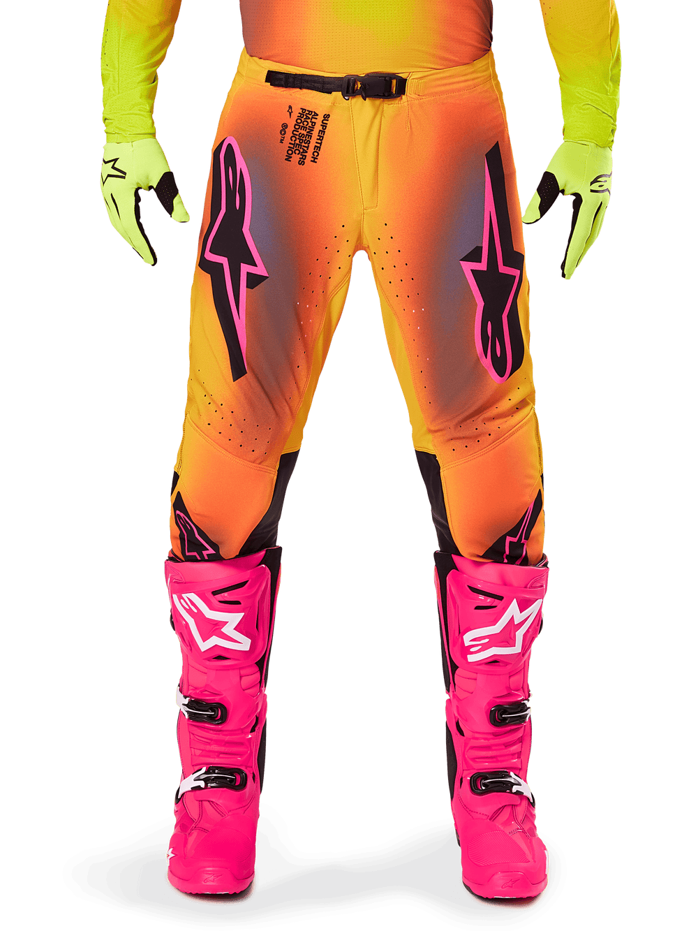 Alpinestars 2025 Supertech Lipan Pants, Motocross Pants, Orange and Yellow gradient with Pink and Black accents, worn with bright pink boots and neon yellow gloves, featuring laser-cut ventilation and a secure waist buckle, pro-level racing gear ensemble