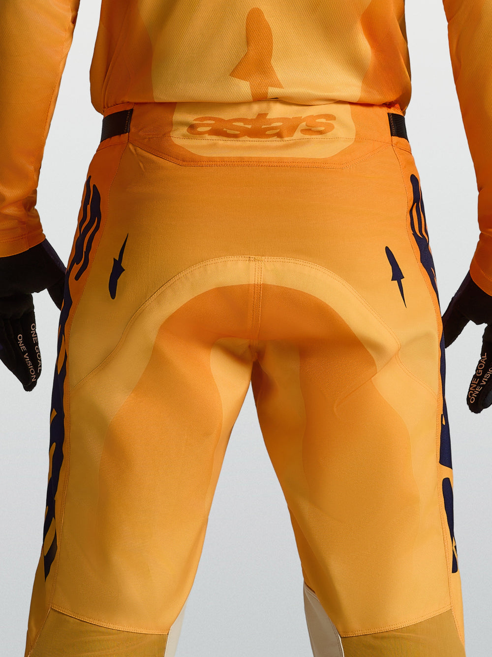 Alpinestars Racer Amber Motocross Pants, Men's, Orange and Deep Blue, featuring a reinforced seat and rear Astars logo.