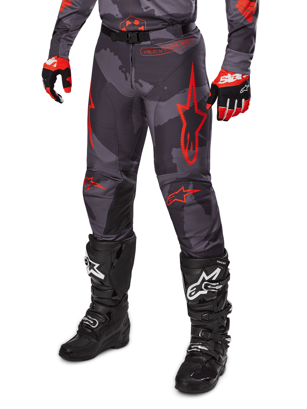 Alpinestars 2025 Racer Hollow Pants, Motocross Pants, Gray Camo and Red, worn with black boots and red gloves, featuring bold red star logos, camouflage pattern, and durable protective panels for off-road riding