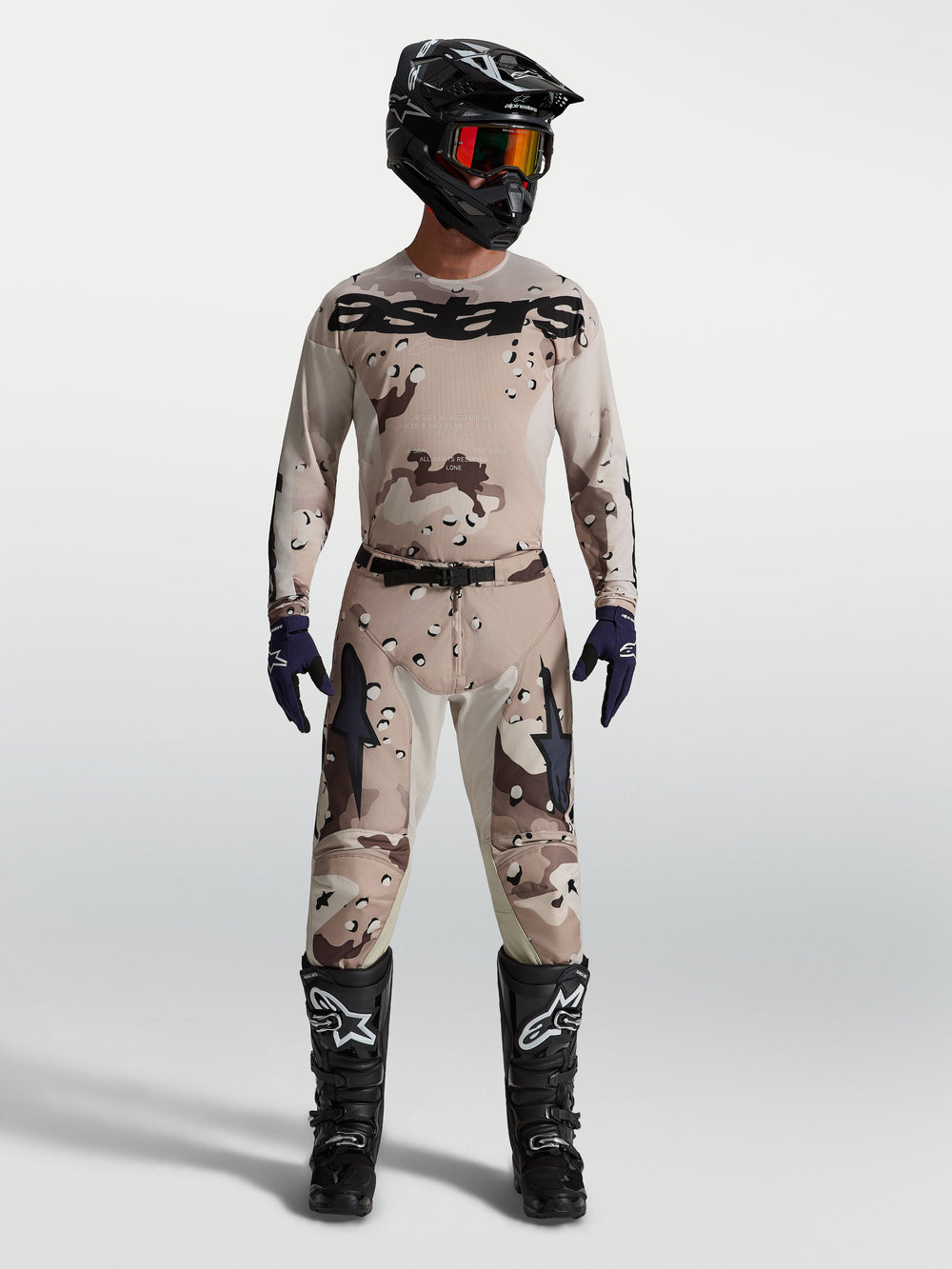 Alpinestars Racer Lone Pants and jersey, Men's Motocross gear set in Desert Camo Black, on model with racing boots.