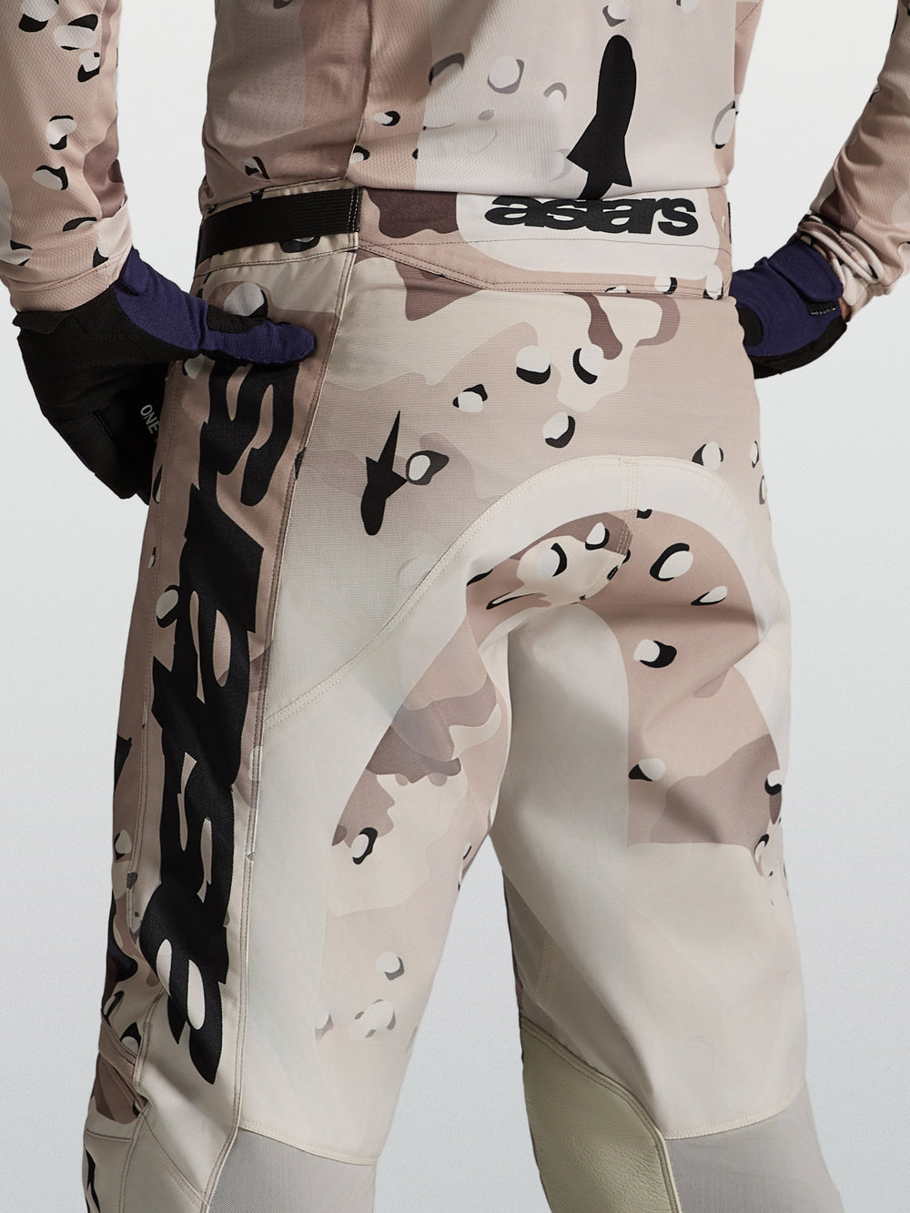 Alpinestars Racer Lone Pants, men's motocross gear in desert camo and black, rear view on-model showing performance race fit.