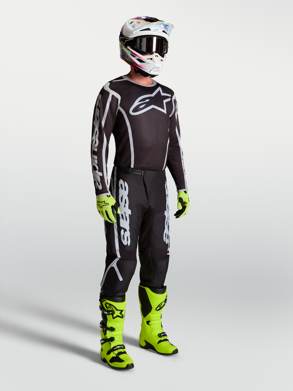 Alpinestars Fluid Apex V2 Pants, black and silver motocross pants for men, durable synthetic gear for off-road riding.