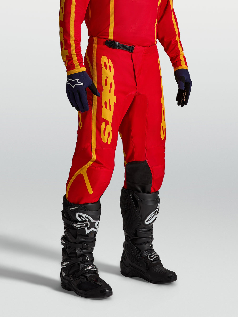 Alpinestars Fluid Apex V2 Pants, Men's Motocross Pants in Red and Gold, featuring reinforced 600D polyfabric.