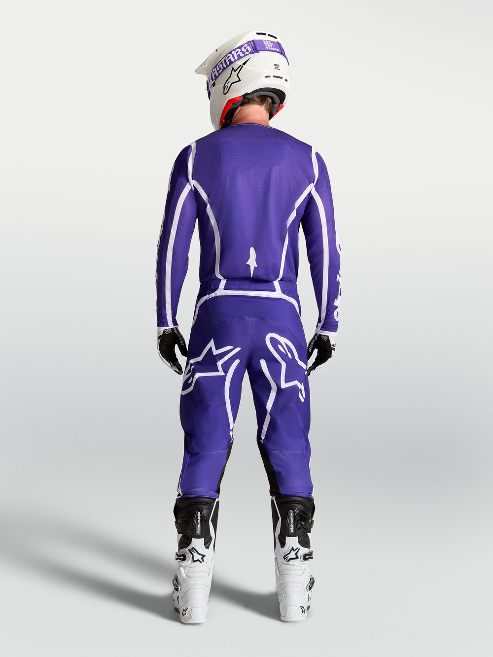 Alpinestars Fluid Apex V2 Pants, Men's Motocross Gear in Deep Blue and White, rear view on model with white racing boots.