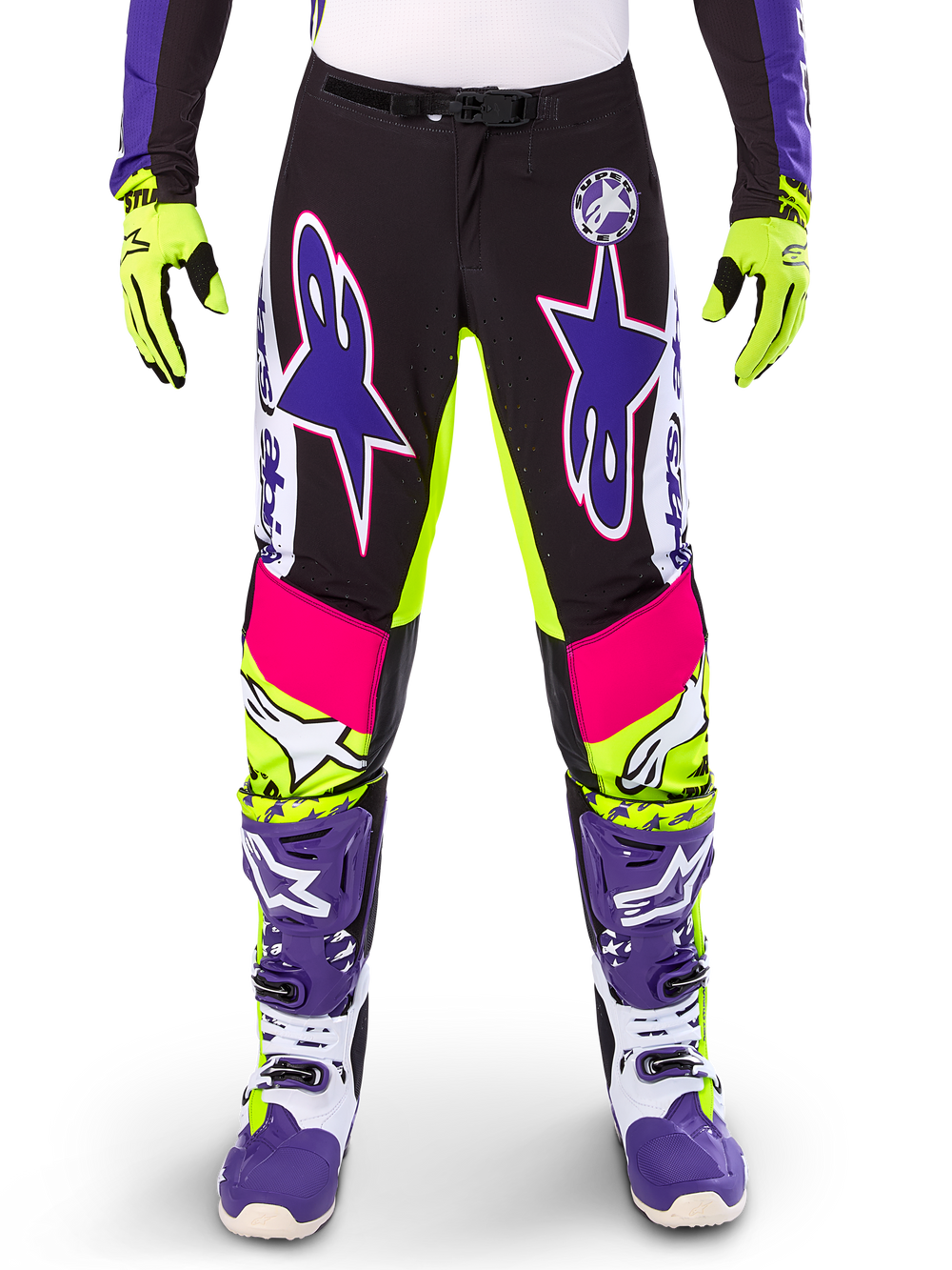 Alpinestars Limited Edition Supertech Dirt Studios Pants, Motocross Pants, White Purple and Yellow Fluo, featuring black panels with neon yellow and pink accents, large purple star logos, shown with matching neon yellow gloves and purple racing boots, durable off-road racing apparel