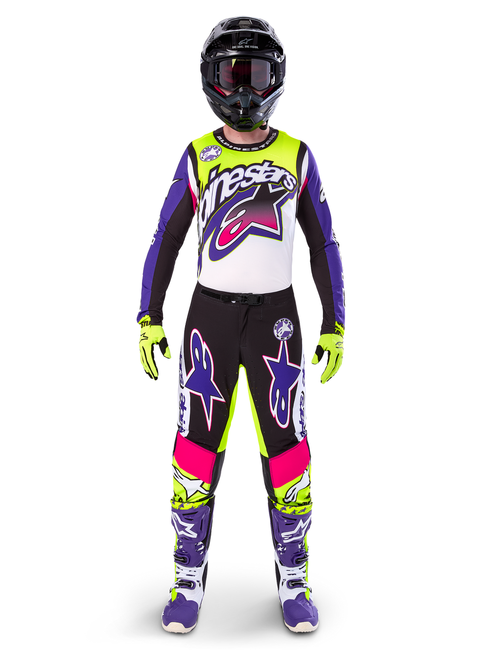 Motocross rider wearing complete racing gear, Limited Edition Supertech Dirt Studios jersey and pants in white, purple, and yellow fluo, black helmet with goggles, purple and white boots, coordinated vibrant outfit for off-road motocross racing