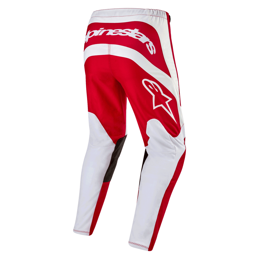 Alpinestars 2024 Fluid Lurv Motocross Pants in Mars Red and White, with durable poly-fabric and a pre-curved riding fit.
