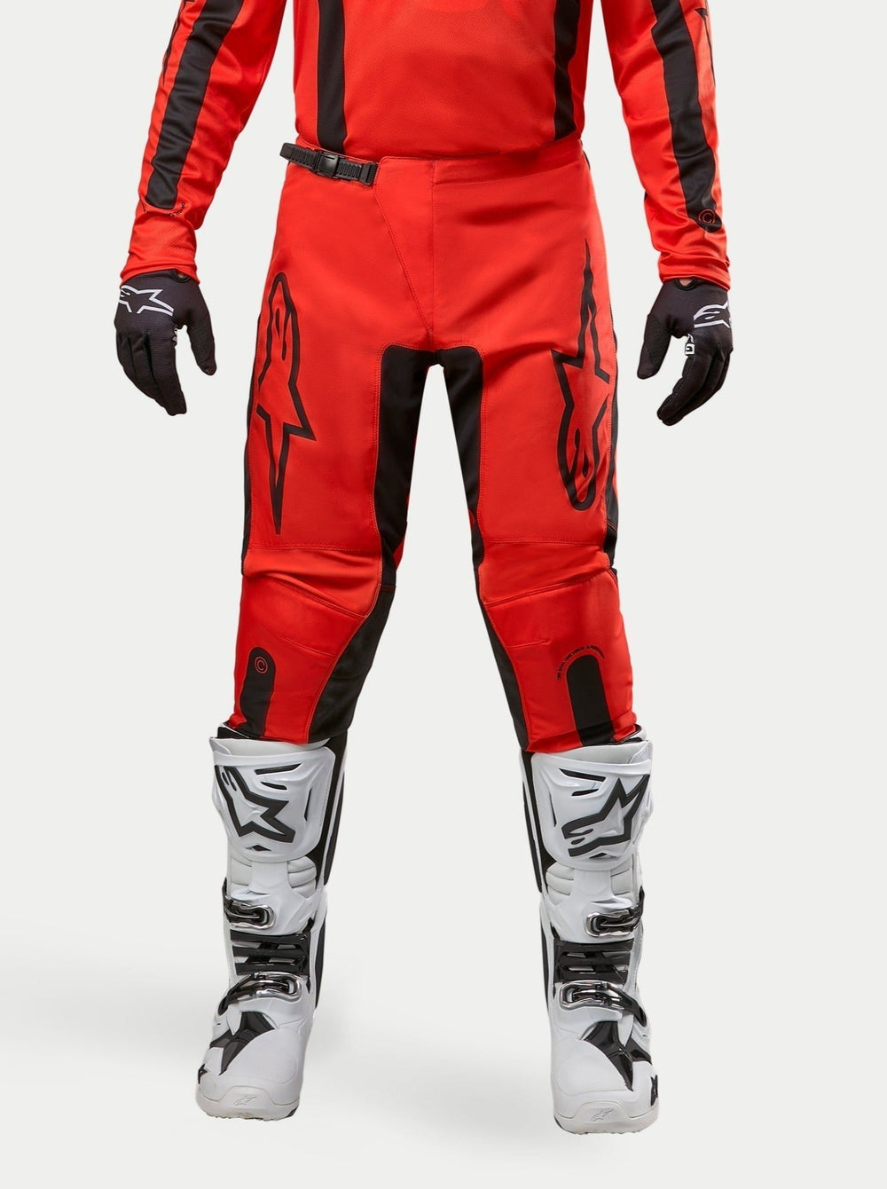 Alpinestars 2024 Fluid Lurv Pants in Hot Orange and Black, men's motocross gear with pre-curved legs and star logos.