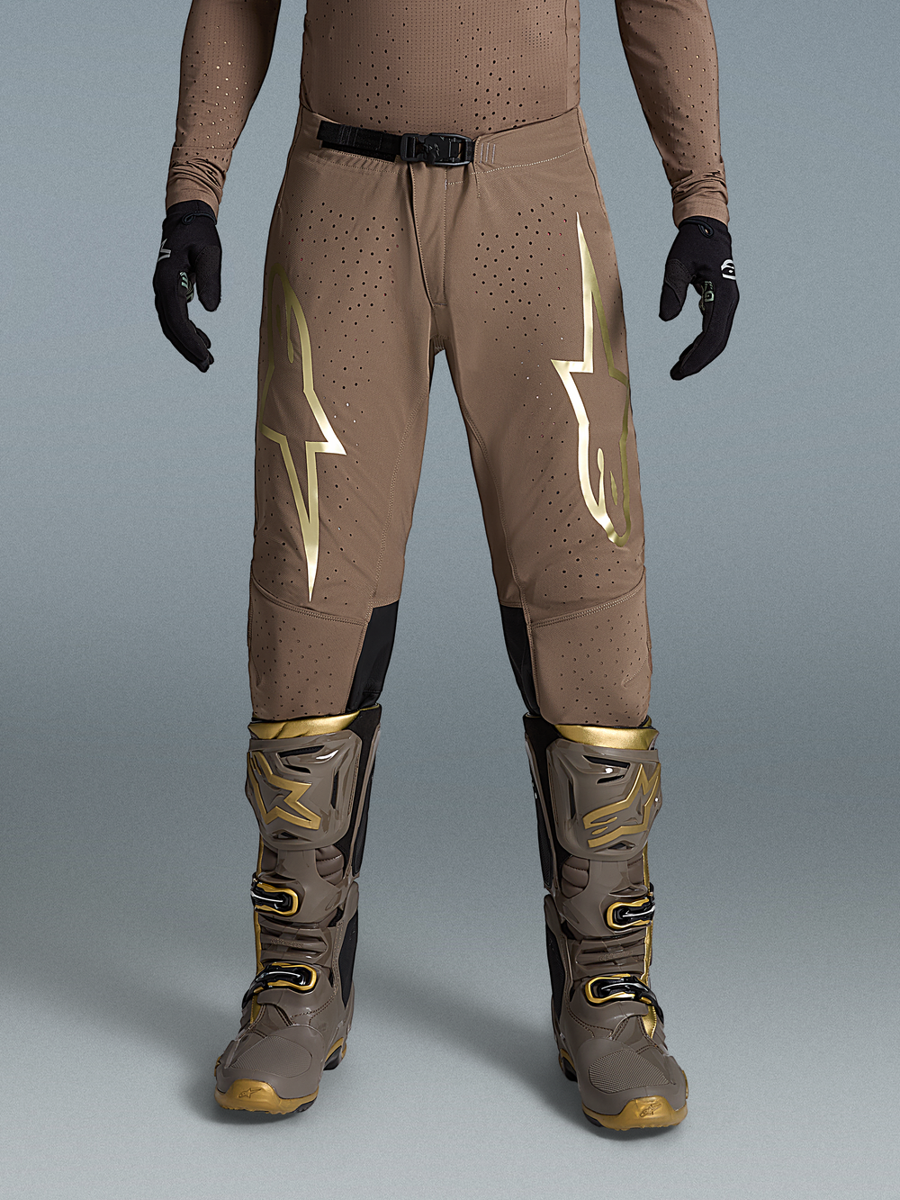 Alpinestars Limited Edition Supertech Air Gold Pants, Brown and Gold Motocross Gear on-model with Tech 10 boots.
