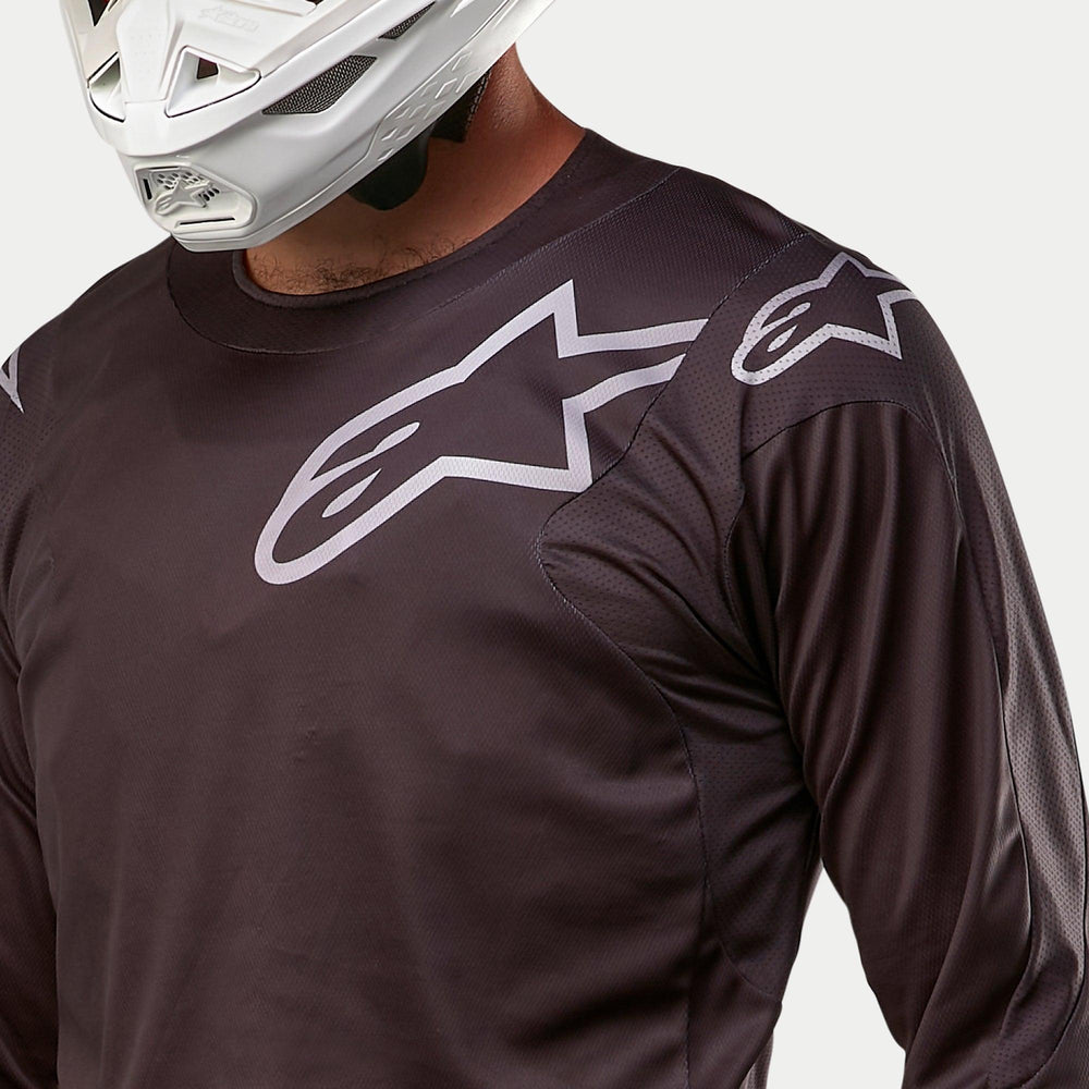 Alpinestars 2024 Racer Graphite Jersey, Men's Black and Gray Motocross Jersey with breathable mesh side panels.
