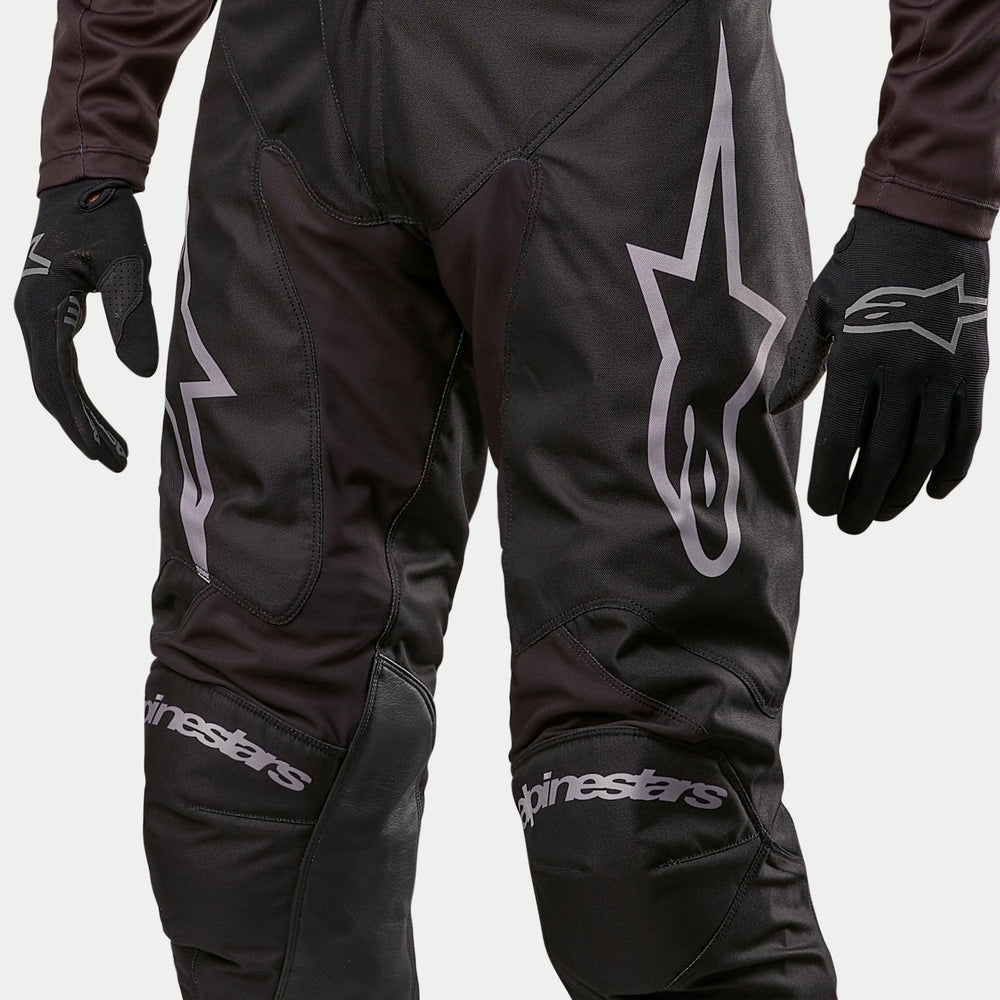 Alpinestars 2024 Racer Graphite Pants, Black Motocross Pants with gray logos and goat leather inner knees.