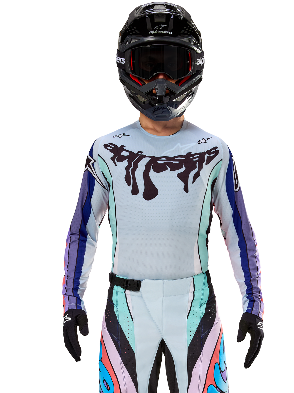 Alpinestars Techstar Imperial LE Jersey and Pants, purple and blue limited edition motocross gear, worn with a black helmet.