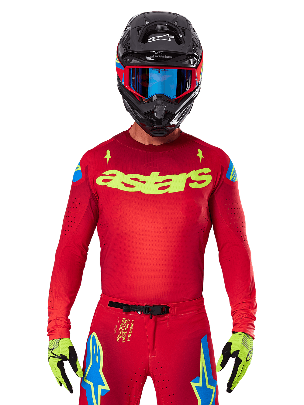 Alpinestars 2025 Supertech Maker Jersey in Bright Red Yellow Fluo, featuring yellow 'astars' chest branding and blue star shoulder designs, worn with matching pants, black helmet, blue goggles, and yellow gloves, professional motocross racing apparel