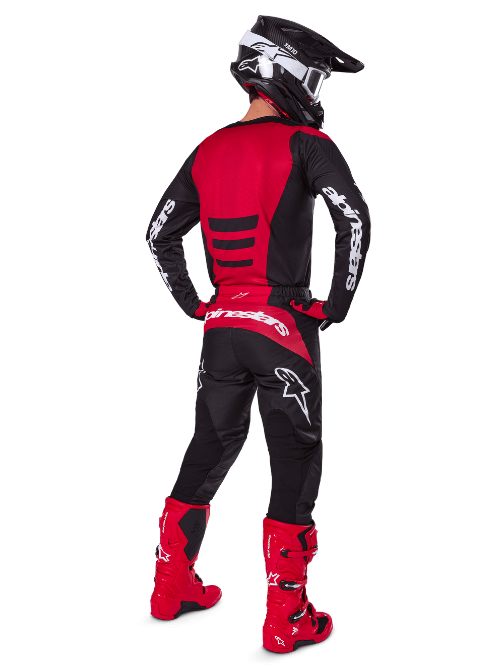 Alpinestars 2025 Fluid Haul Jersey, black and red motocross gear, rear view of rider in full off-road racing kit.