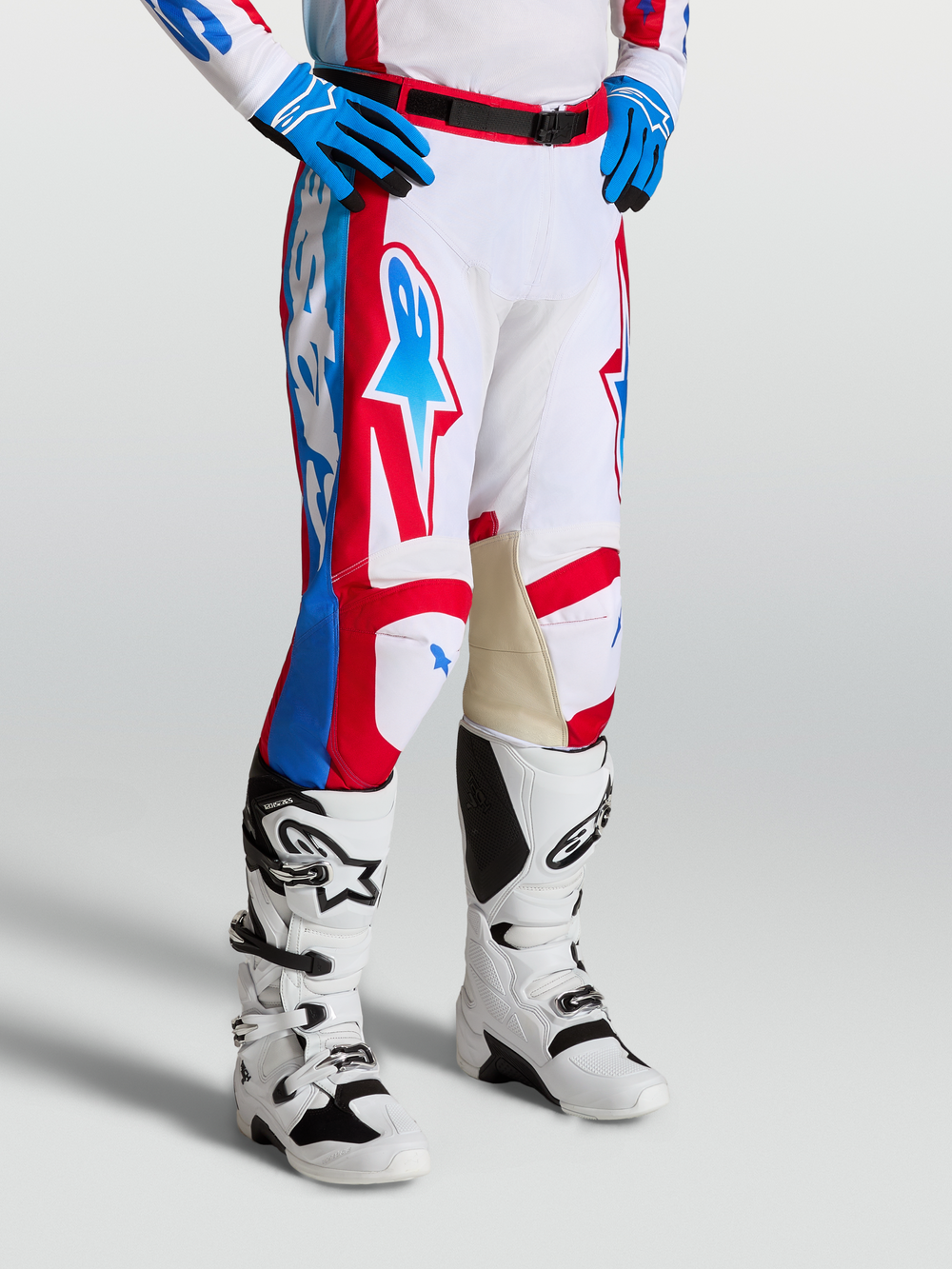 Alpinestars Racer Hunt Pants, motocross racing pants in White, Red, and Blue with pre-curved legs and leather inner knees.